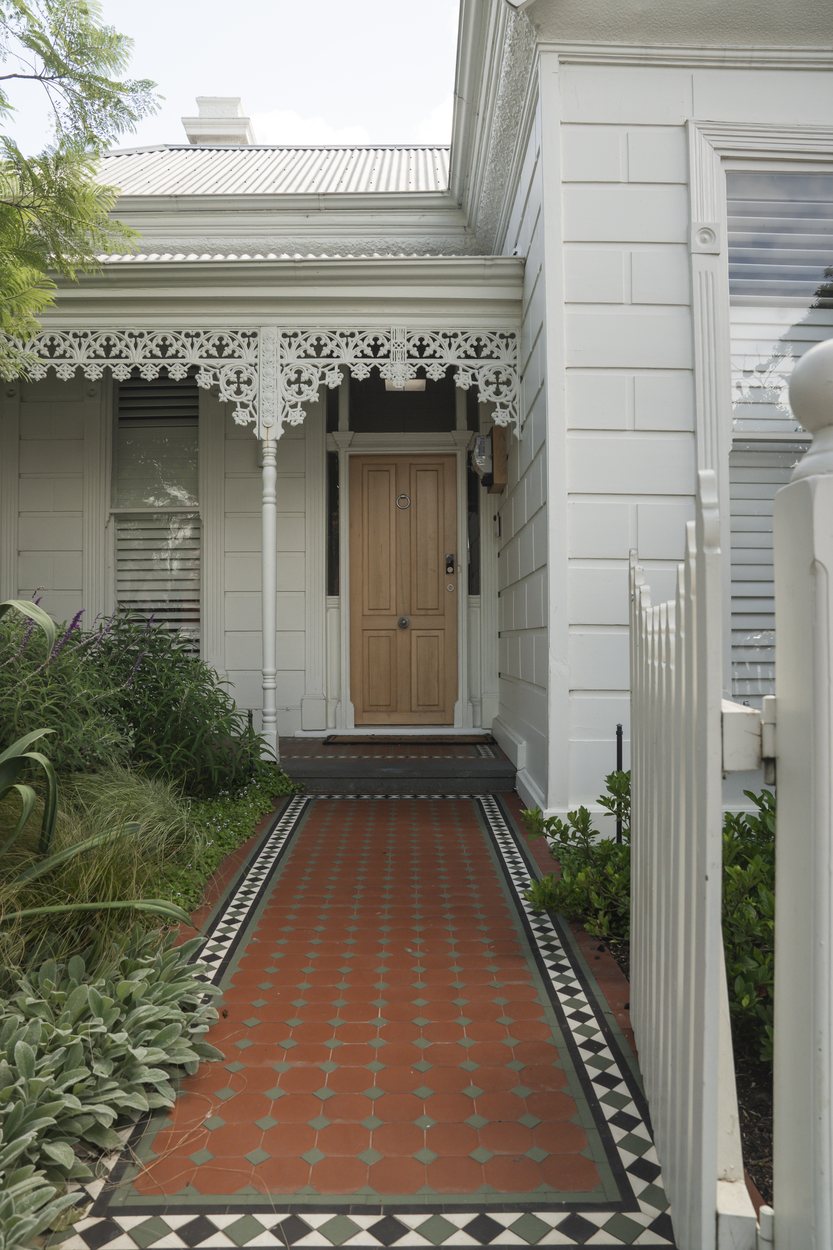 The original tessellated tile path leading to the front door of the weatherboard cottage