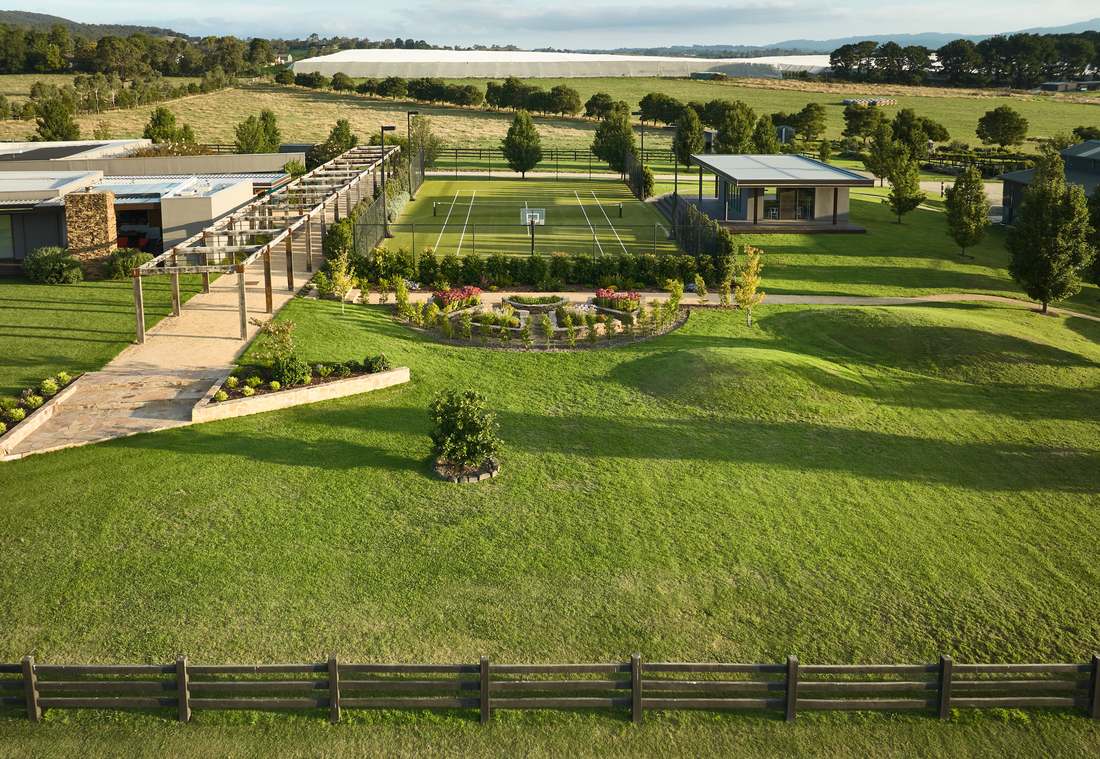 Aerial view of the whole garden, the pergola, court and pavilion set into open paddock